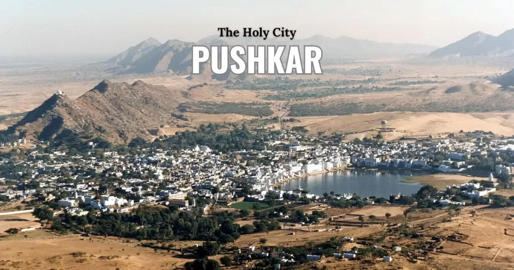 Pushkar Rajasthan | Guide to Brahma Temple and Camel Fair Aerial view of the holy Pushkar Lake and ghats surrounded by the Thar Desert mountains in Rajasthan India.